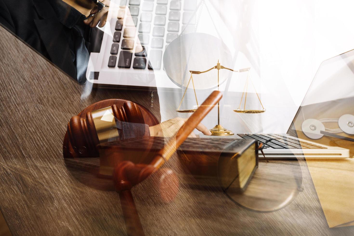 Male lawyer working with contract papers and wooden gavel on tabel in courtroom. justice and law ,attorney, court judge, concept. photo