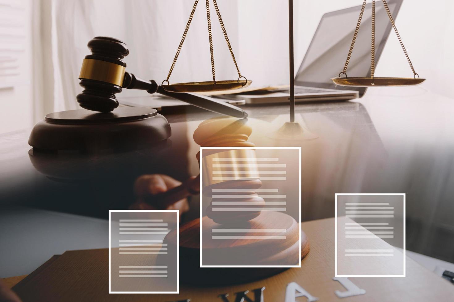 Business and lawyers discussing contract papers with brass scale on desk in office. Law, legal services, advice, justice and law concept photo