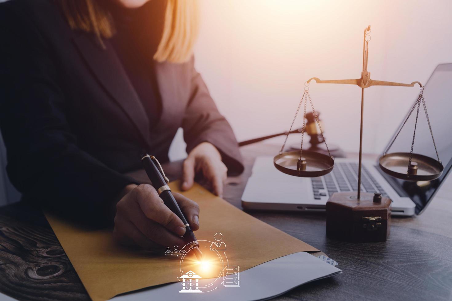 Business and lawyers discussing contract papers with brass scale on desk in office. Law, legal services, advice, justice and law concept picture with film grain effect photo