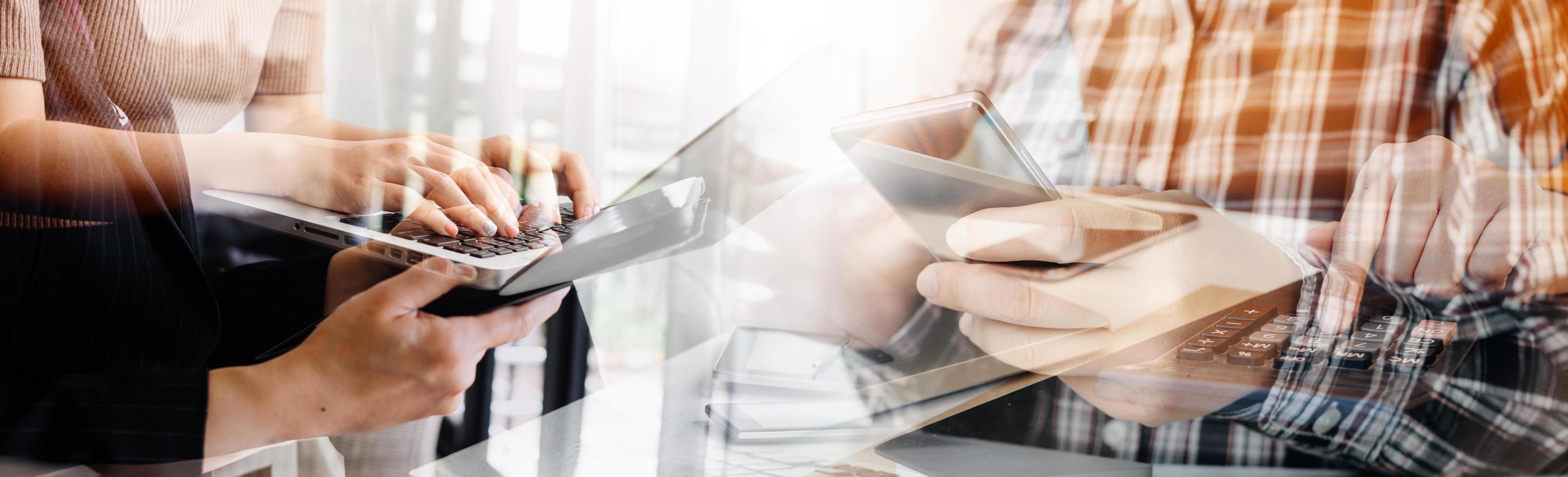 Businessman and team analyzing financial statement Finance task. with smart phone and laptop and tablet. Wealth management concept photo