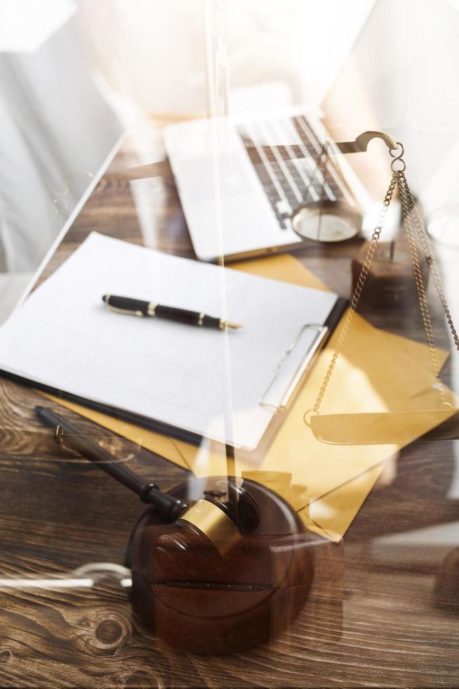 Business and lawyers discussing contract papers with brass scale on desk in office. Law, legal services, advice, justice and law concept picture with film grain effect photo