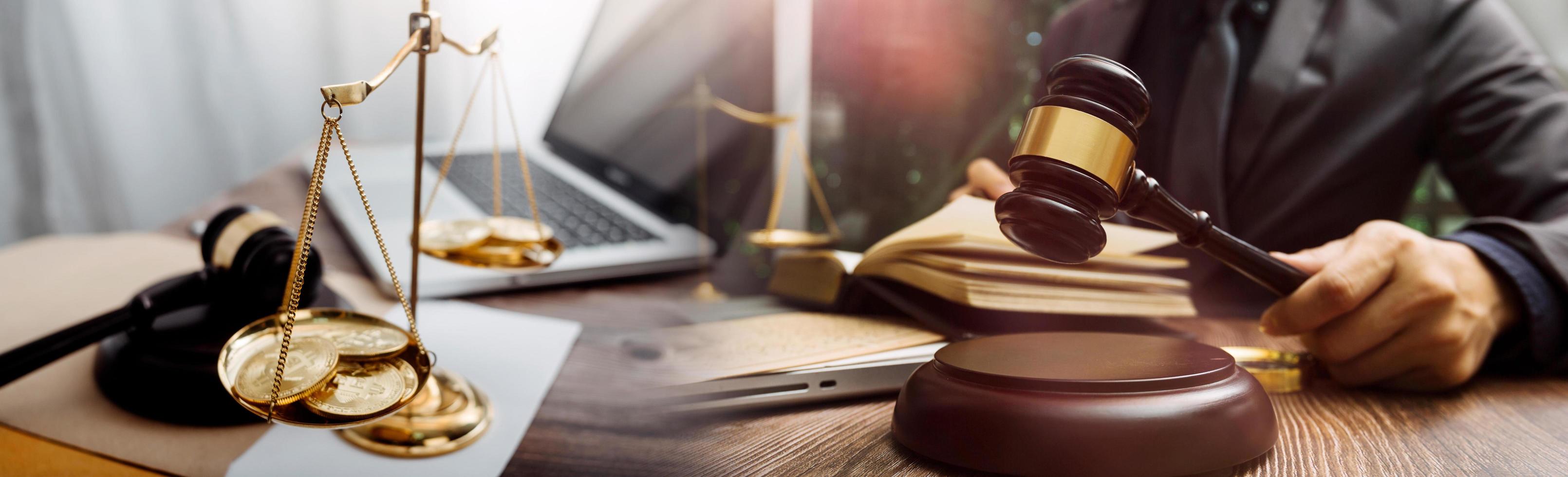 Business and lawyers discussing contract papers with brass scale on desk in office. Law, legal services, advice, justice and law concept picture with film grain effect photo