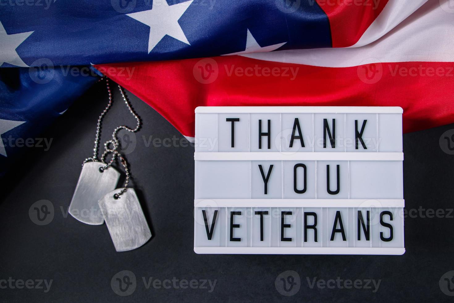 Memorial Day in United States. Thanks to the veterans. Military dog tags and American flag. Celebration concept. photo