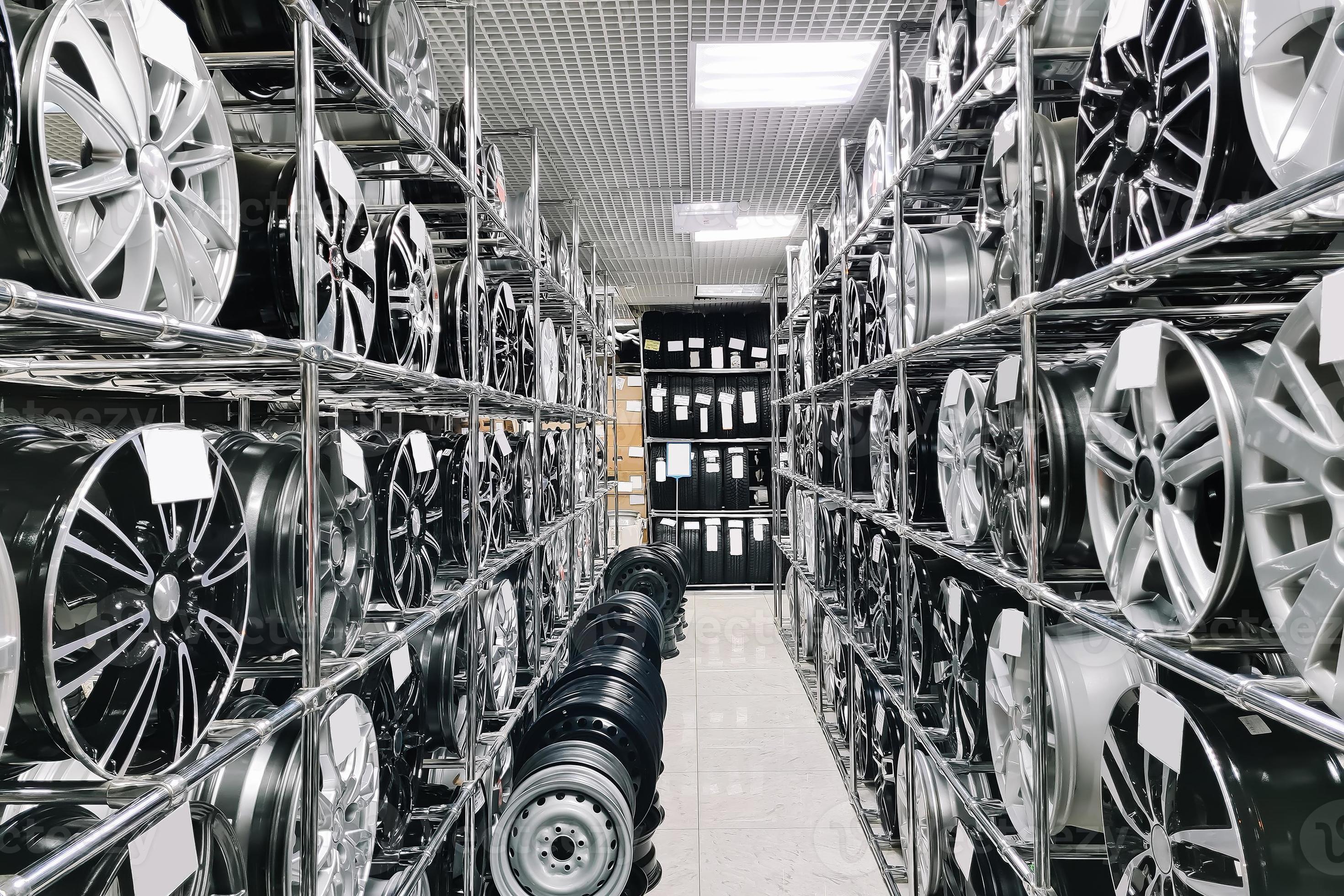 Auto shop selling car rims. Stand for sale of alloy wheels. Discounts at auto parts store