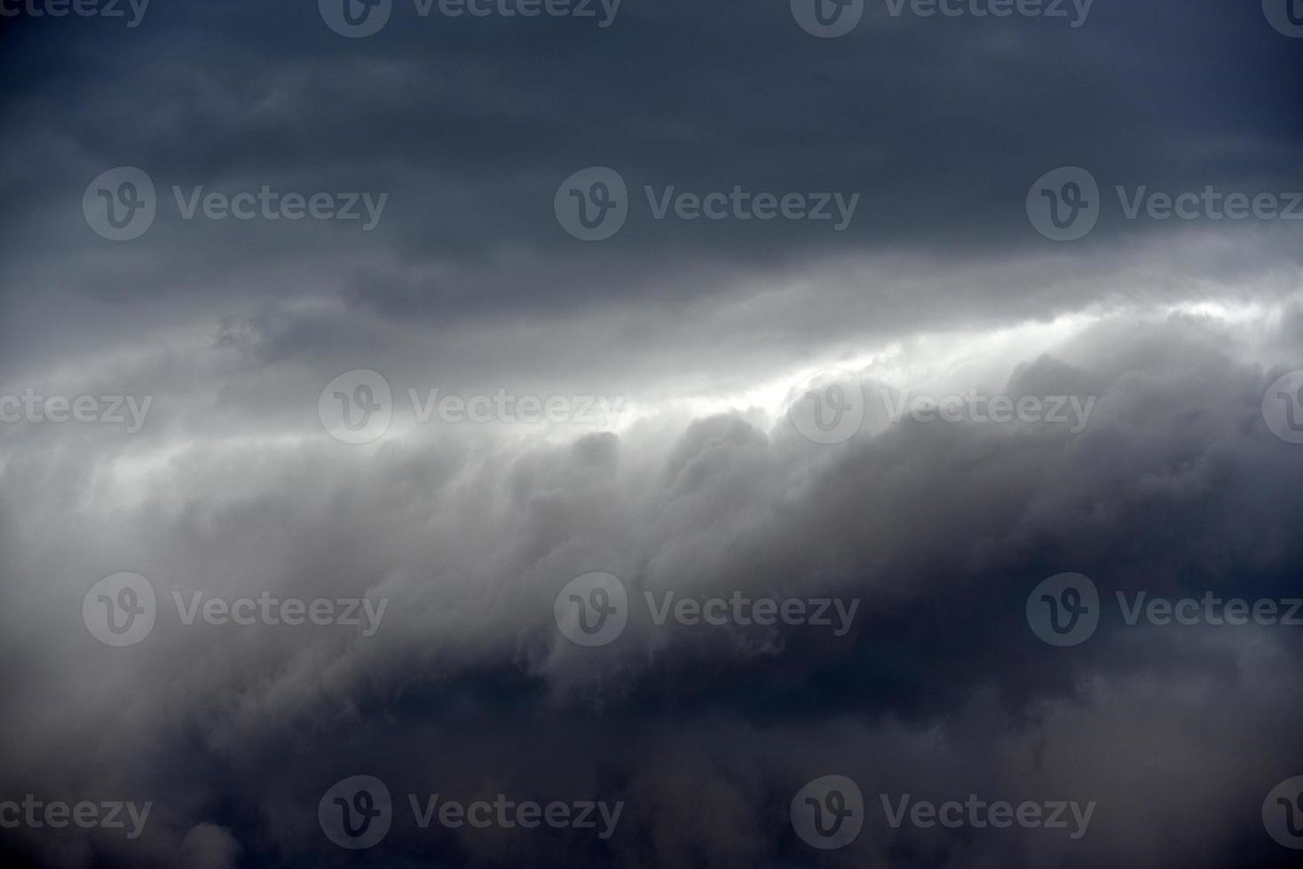 Black thunderstorm storm clouds on a summer day. Beautiful terrible thunderstorm. photo