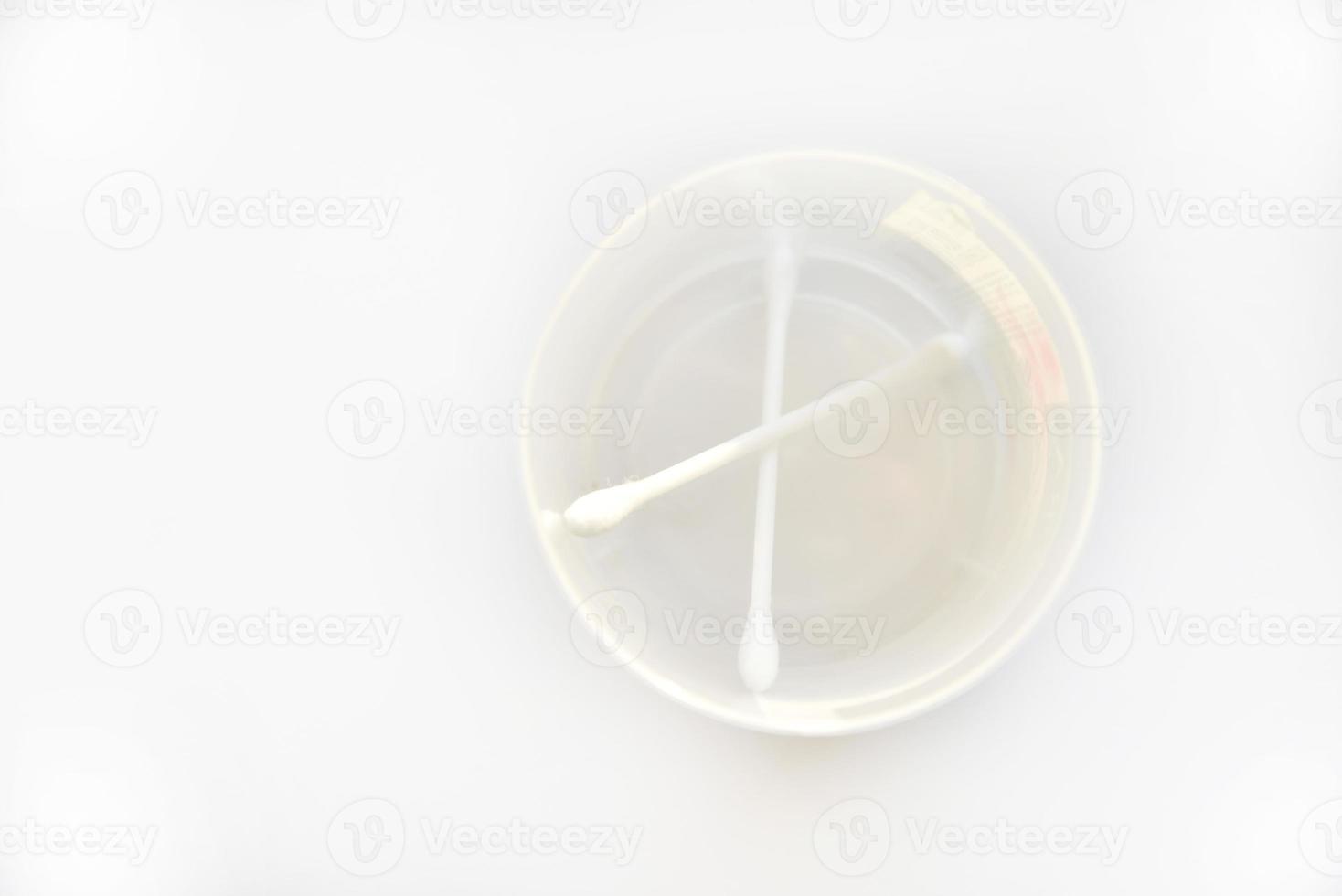 Cotton swabs for cleaning ears on a white background photo