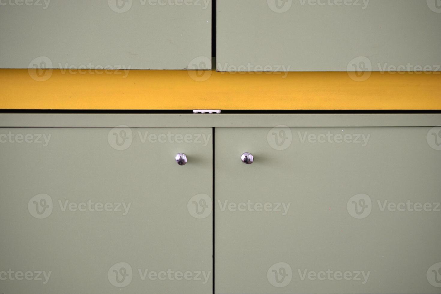 Green bedside table with silver handles indoors photo