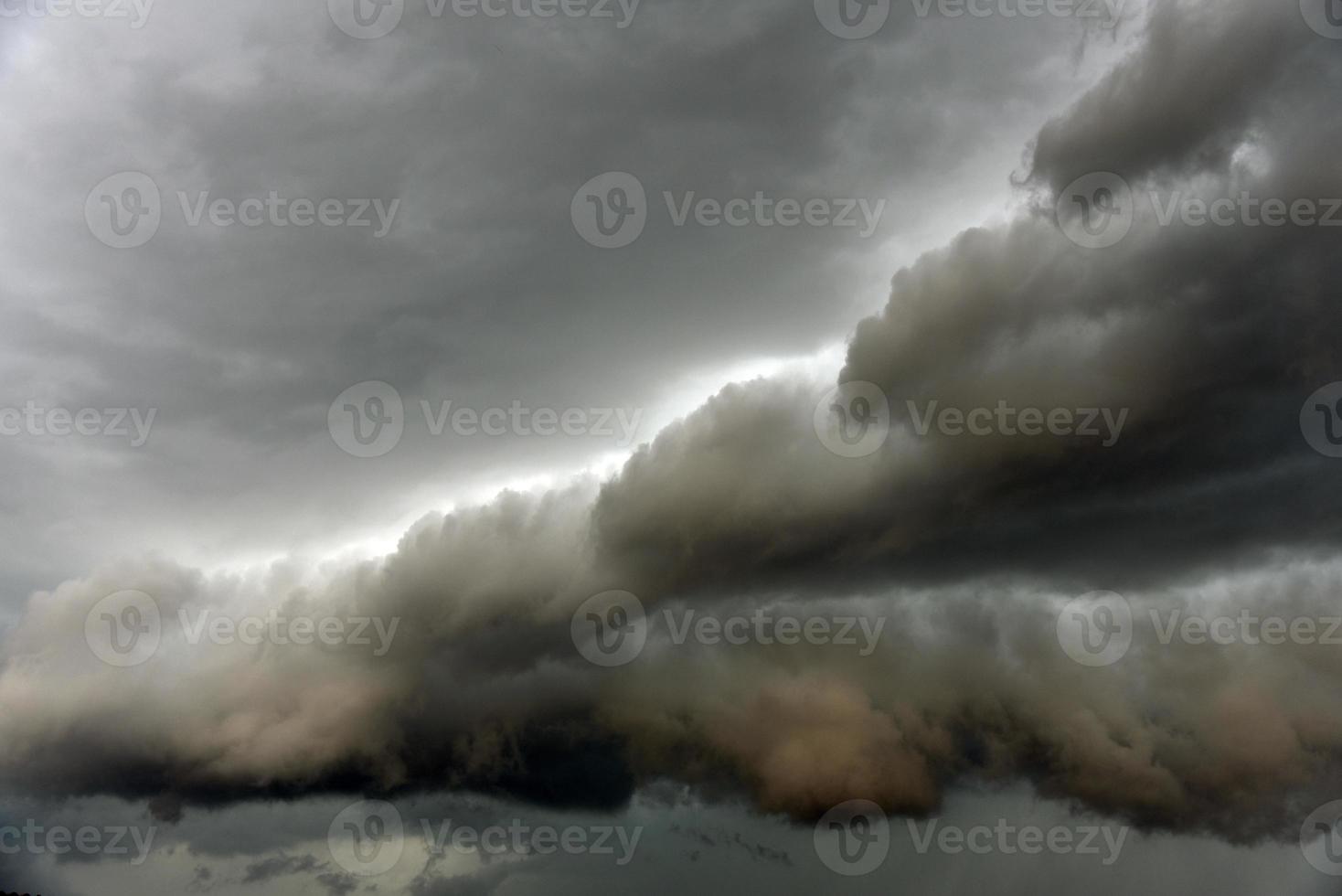 Black thunderstorm storm clouds on a summer day. Beautiful terrible thunderstorm. photo
