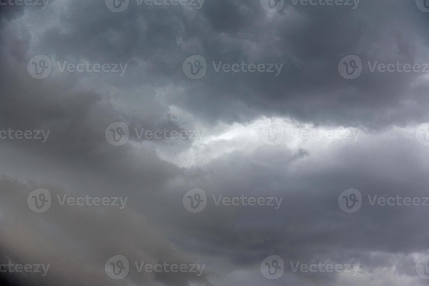 Black thunderstorm storm clouds on a summer day. Beautiful terrible thunderstorm. photo