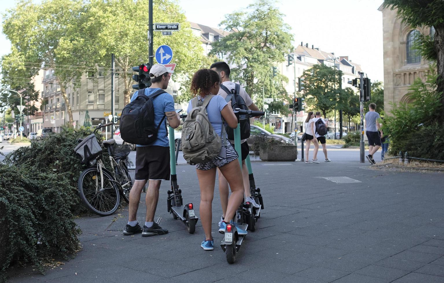 Dusseldorf, Germany - July 24, 2019 - E-mobility in Germany. Inhabitants of Dusseldorf trying out electric scooters. photo