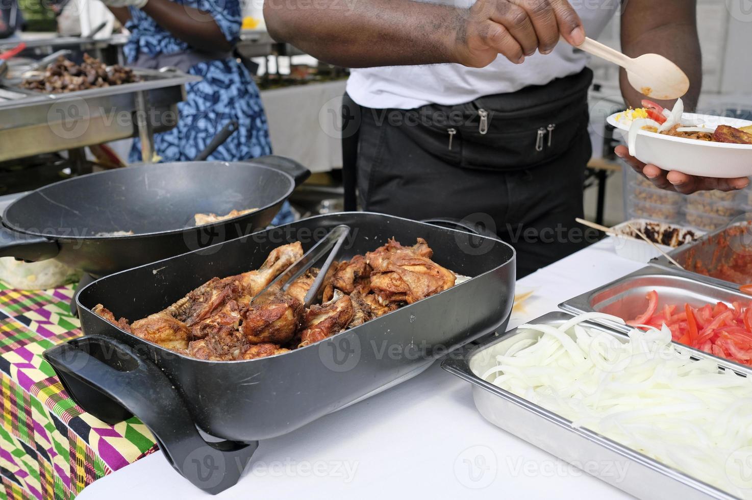 Grilled chicken at a BBQ street vendor in Ghana photo