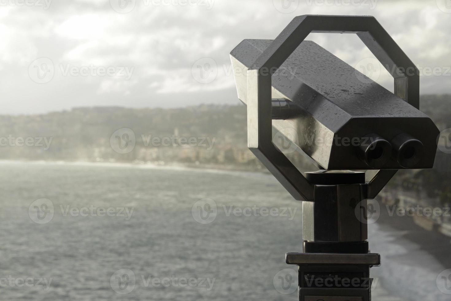 Viewpoint with telescope in Nice, France, after rain photo