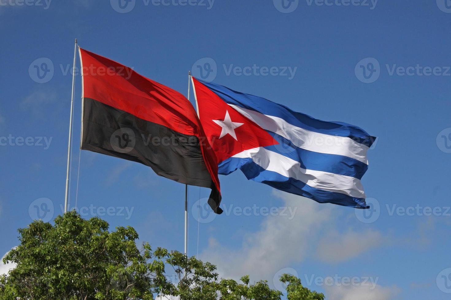 The flags of Cuba as well as of the 26th of July Movement in Havana, Cuba. photo