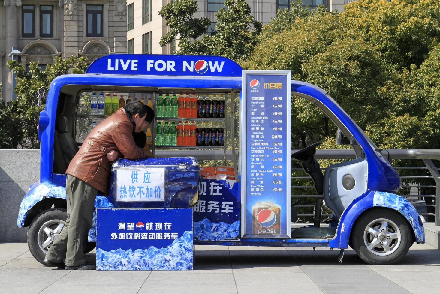 Shanghai, China - April 15, 2018 - Street vendor selling Pepsi next to Huangpu River in Shanghai. photo