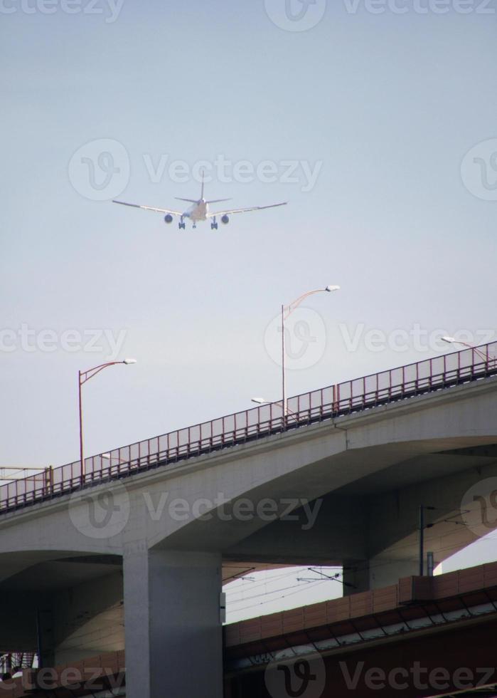 Aircraft noise - low-flying air plane during its approach photo