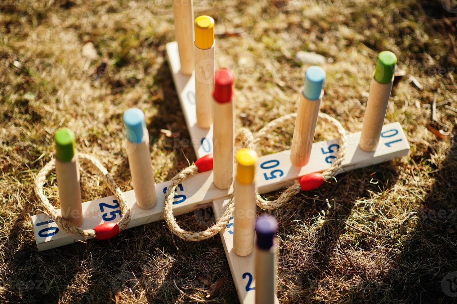 Traditional wooden ring toss set on a grass. photo