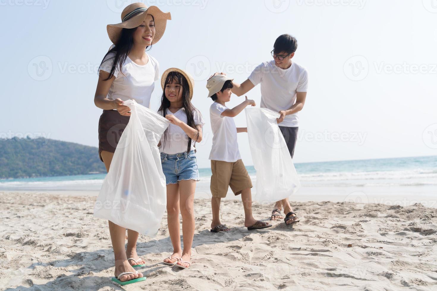 Asian Family walking at beach with kids happy vacation concept photo