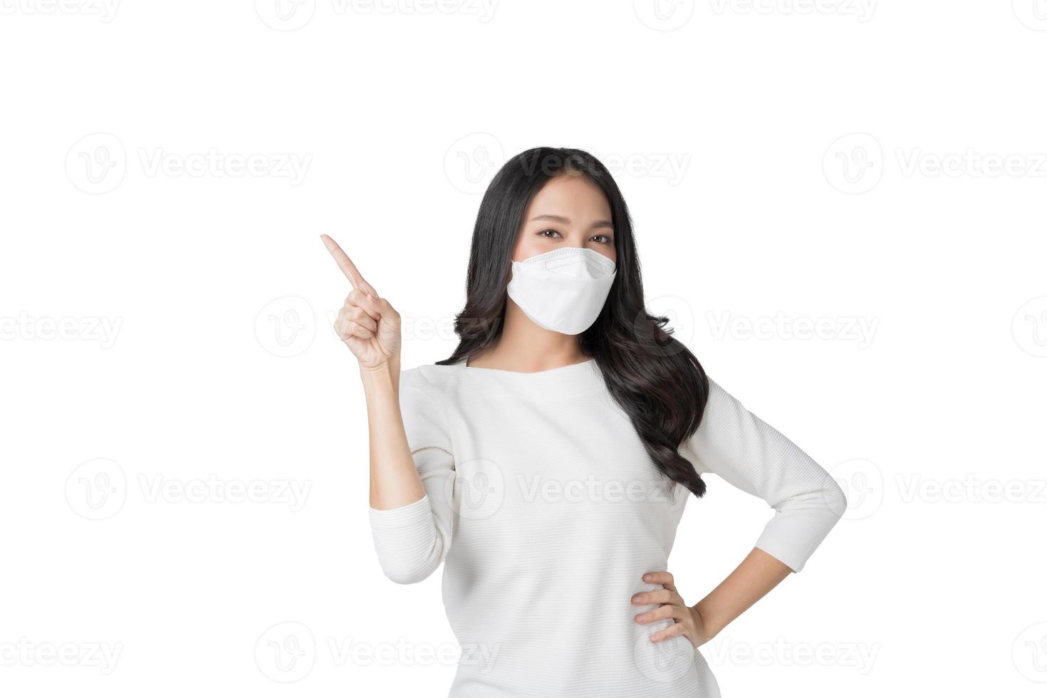 Young Asian woman wearing hygienic mask to prevent infection corona virus Air pollution pm2.5 in isolated on white background photo