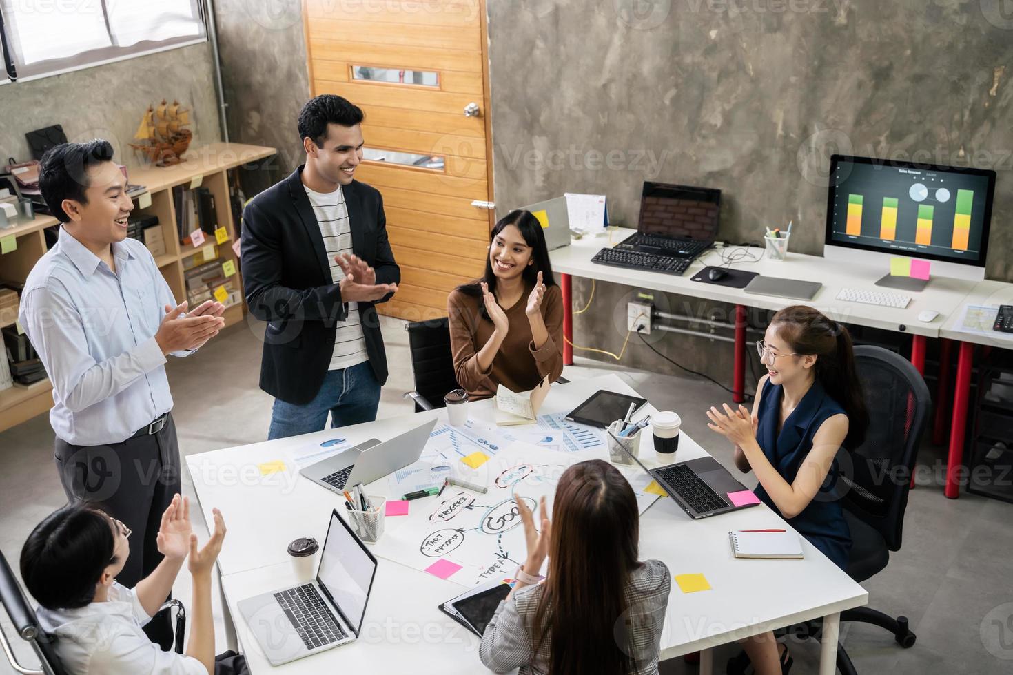 Group of Asian business people team meeting in modern office working design planning and ideas concept photo