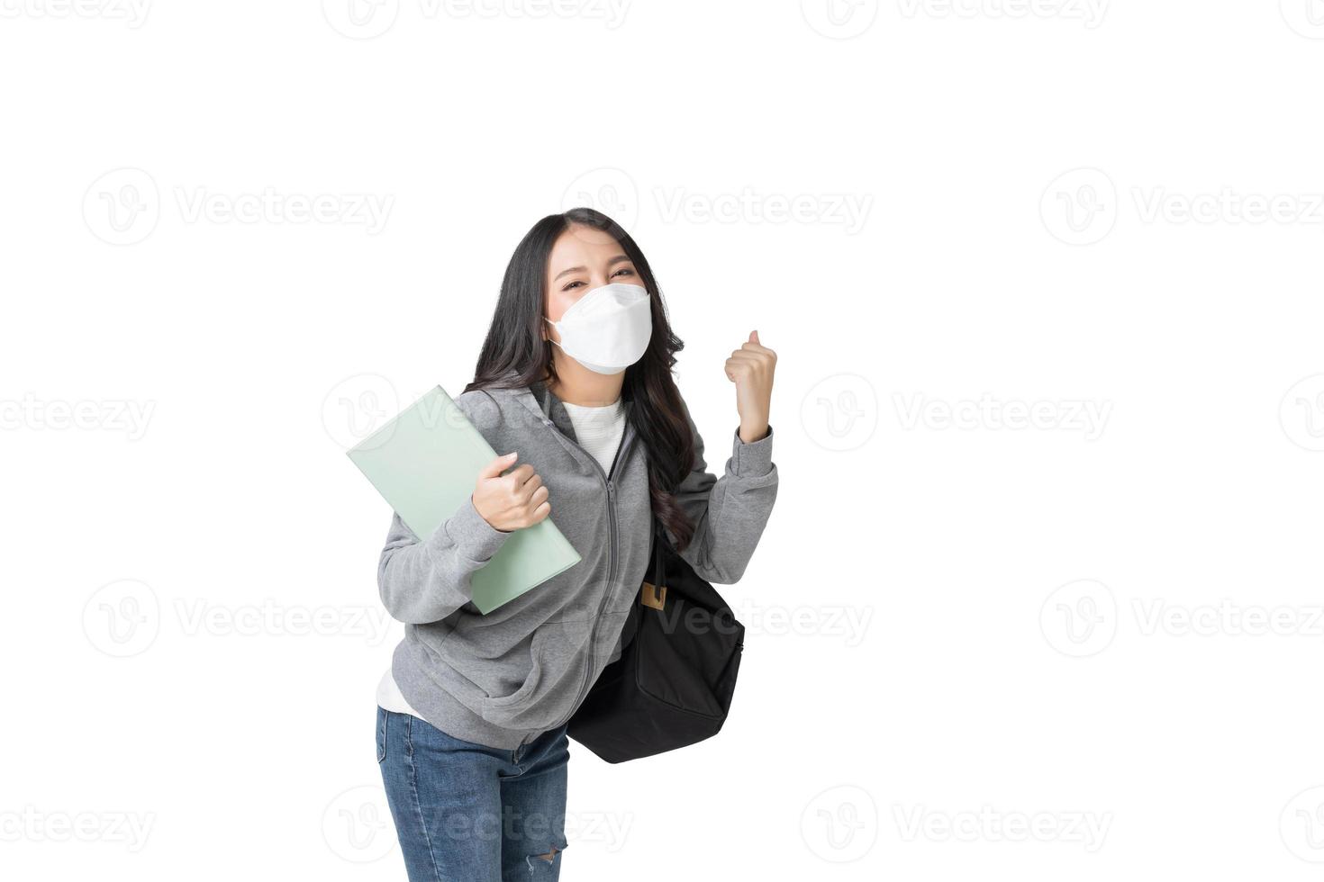 Young Asian woman wearing hygienic mask to prevent infection corona virus Air pollution pm2.5 in isolated on white background photo