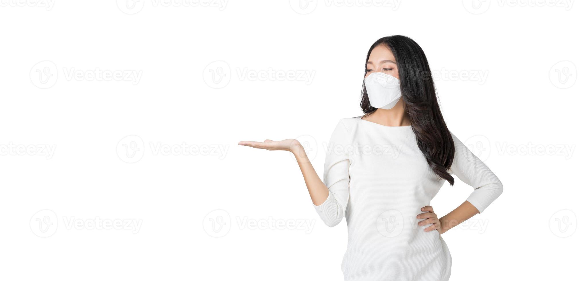 Young Asian woman wearing hygienic mask to prevent infection corona virus Air pollution pm2.5 in isolated on white background photo