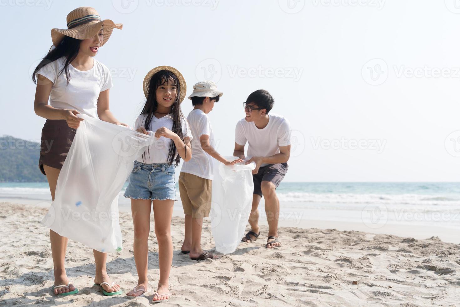 Asian Family walking at beach with kids happy vacation concept photo