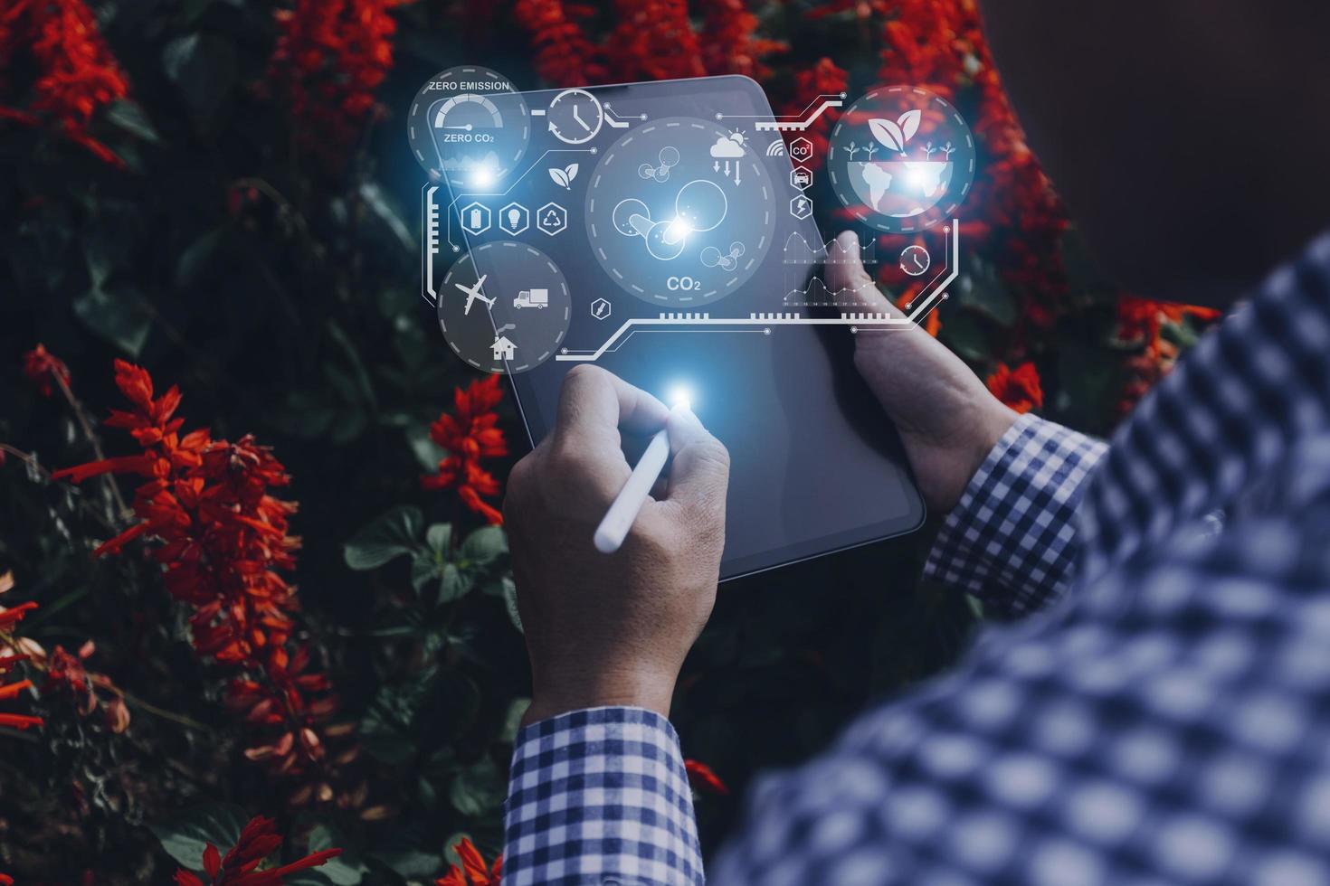 Selective focus. Architect team planning design apply renewable or solar energy on architectural building model with virtual reality technology hologram. Alternative green energy in future concept. photo