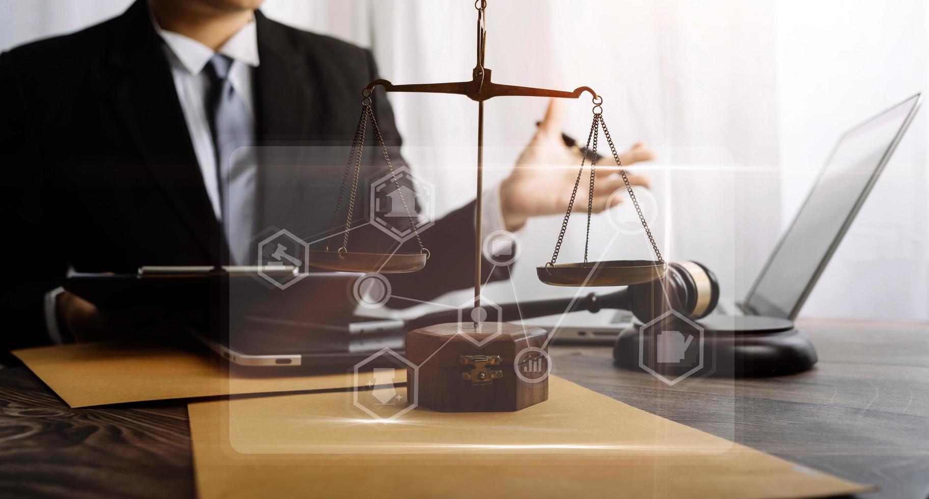 justice and law concept.Male judge in a courtroom on wooden table and Counselor or Male lawyer working in office. Legal law, advice and justice concept. photo