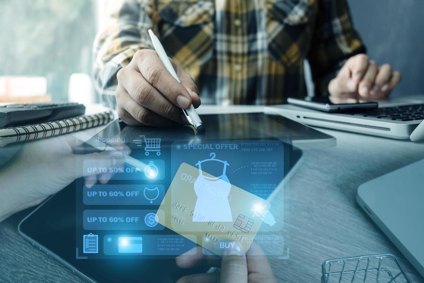 Hands holding credit card and using laptop. Online shopping photo