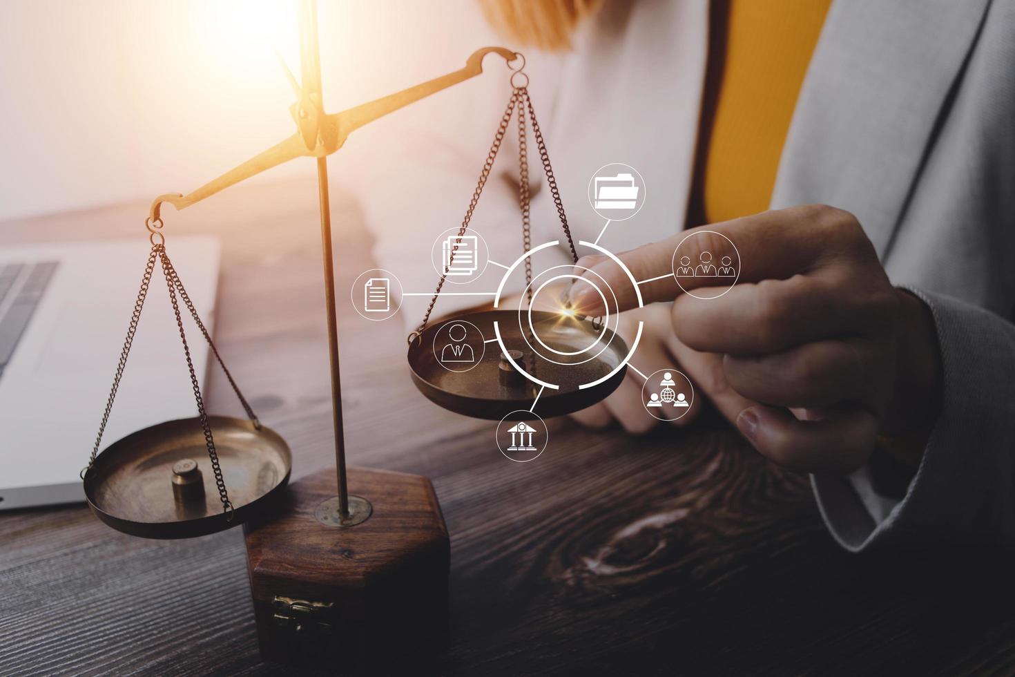 Business and lawyers discussing contract papers with brass scale on desk in office. Law, legal services, advice, justice and law concept picture with film grain effect photo