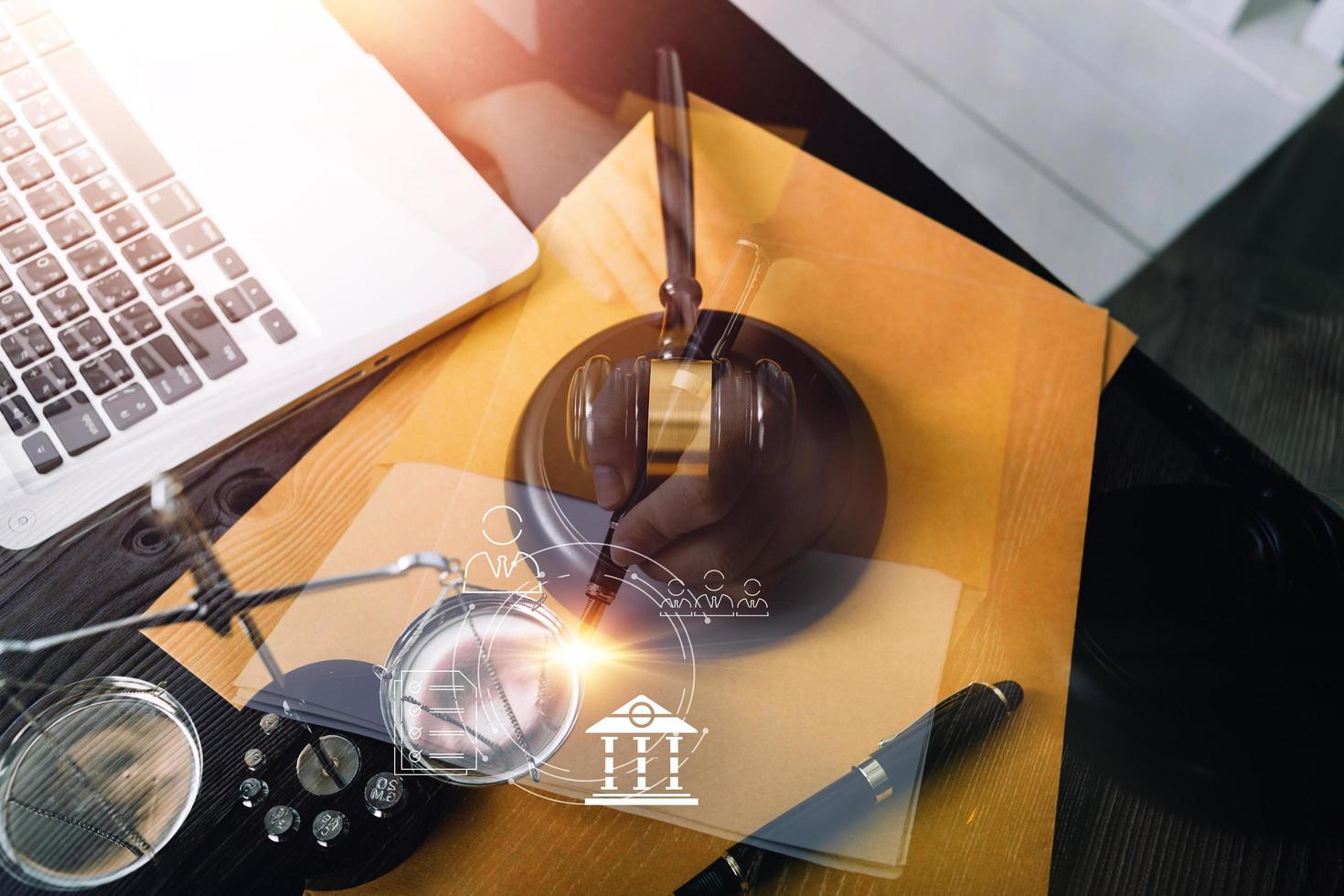 Business and lawyers discussing contract papers with brass scale on desk in office. Law, legal services, advice, justice and law concept picture with film grain effect photo
