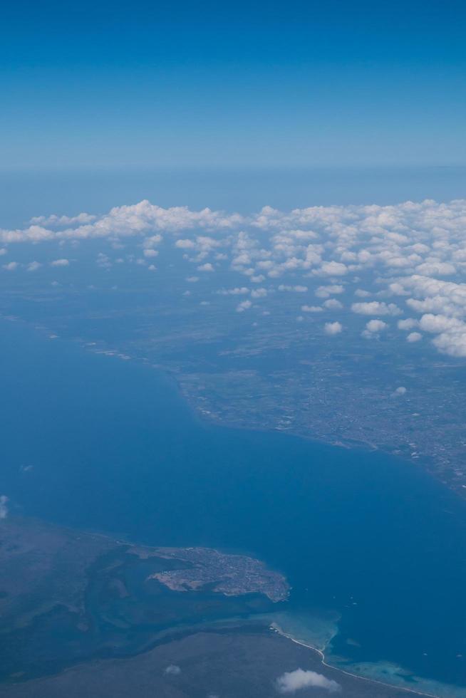 Bali island in tropical sea, veiw from airplane sight photo