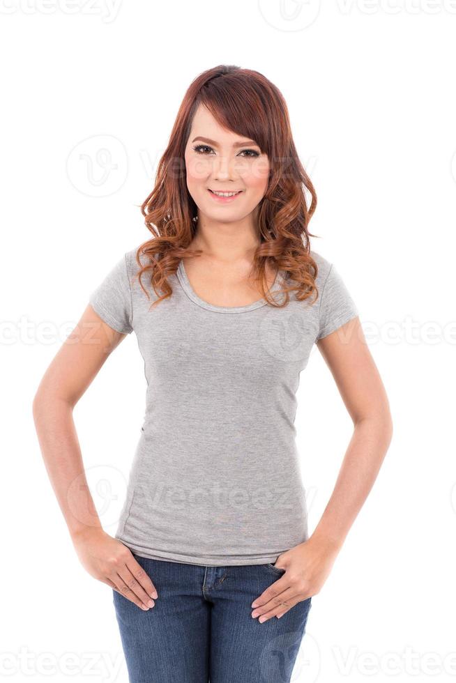 happy teenage girl in blank gray t-shirt on white background photo