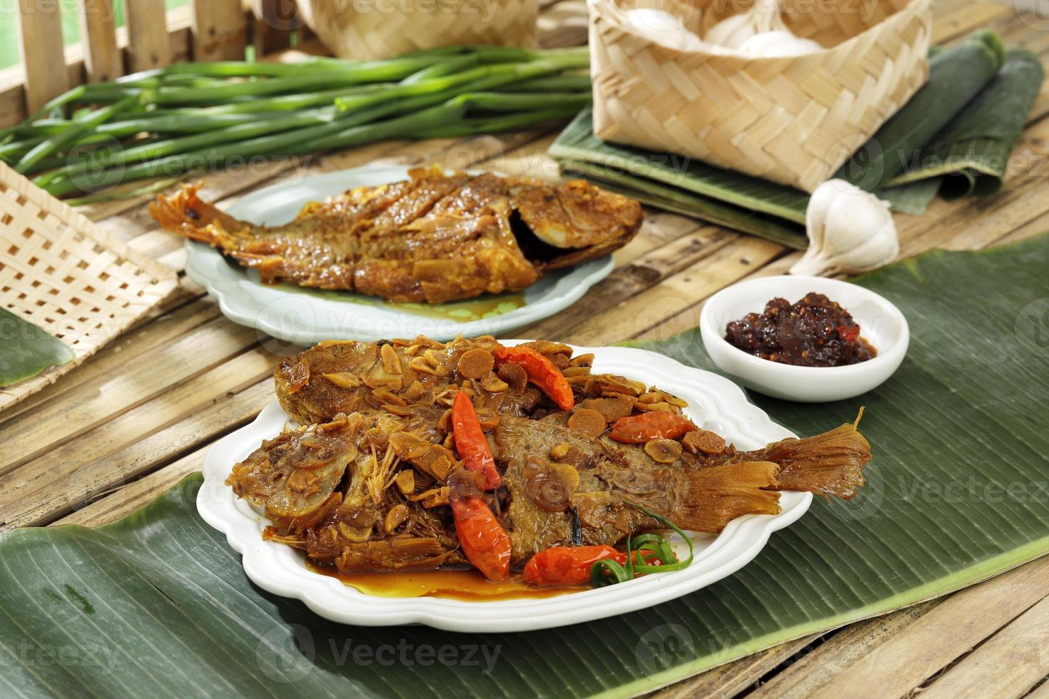 Pindang Ikan Nila, Stewed Tilapia Fish with Various Spice and Chilli. Traditional Indonesian Sundanese Food photo