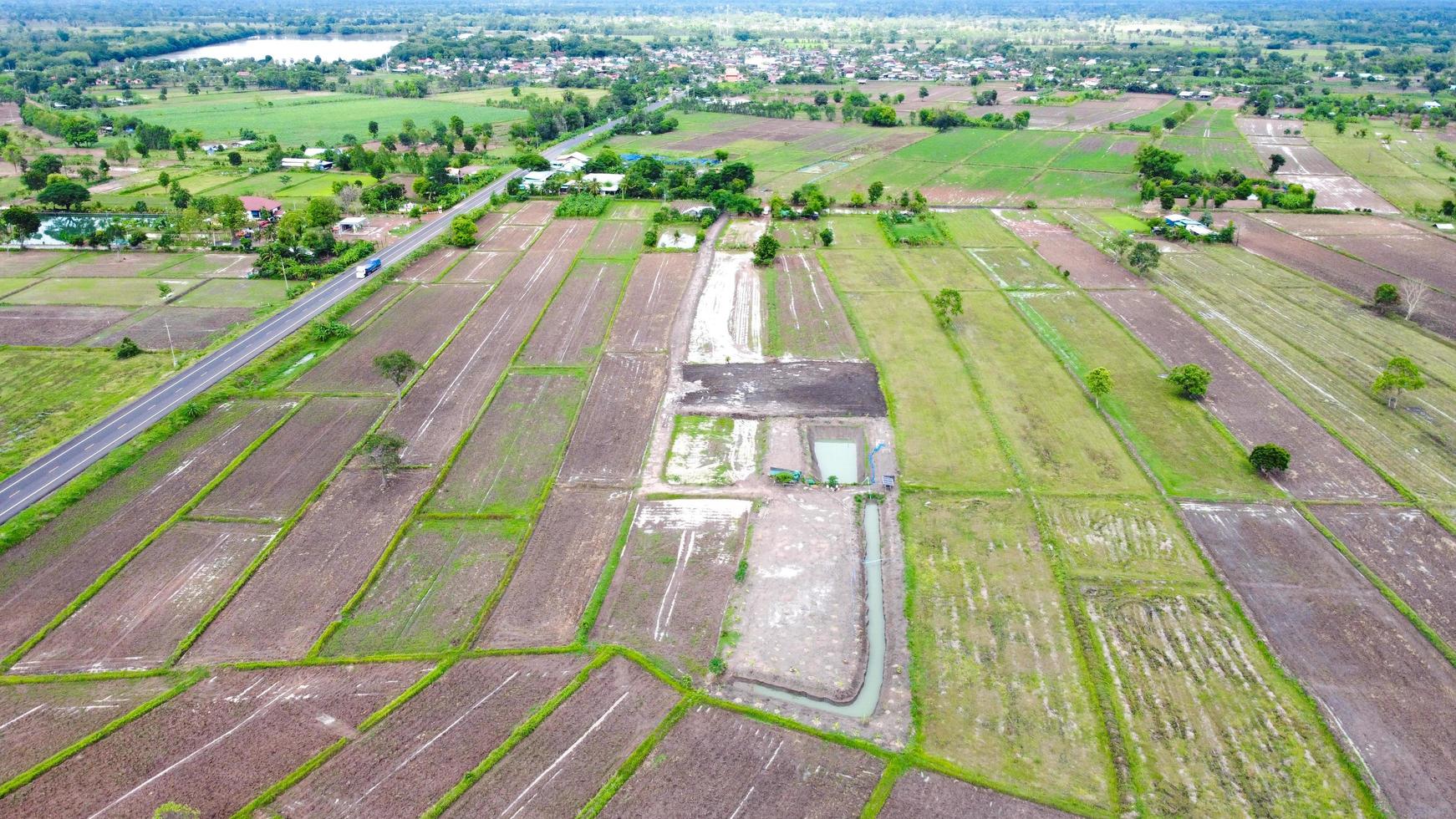 Aerial view of green fields and farmlands in rural Thailand. photo