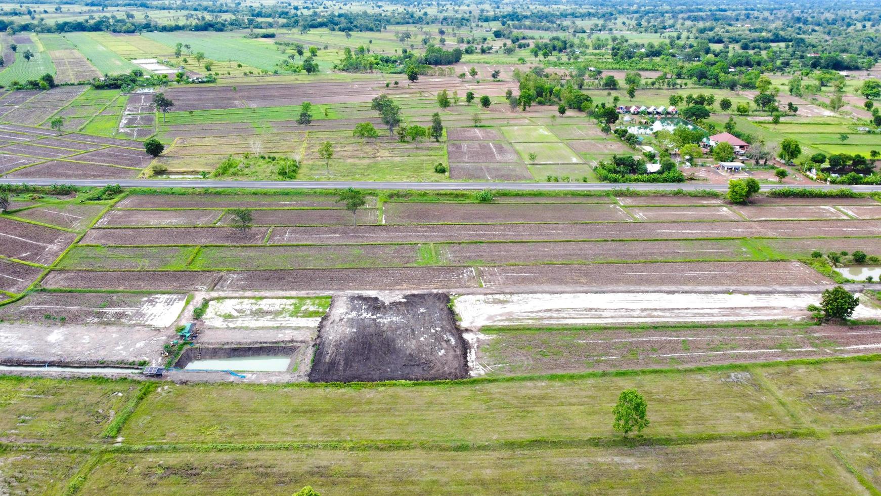 Aerial view of green fields and farmlands in rural Thailand. photo