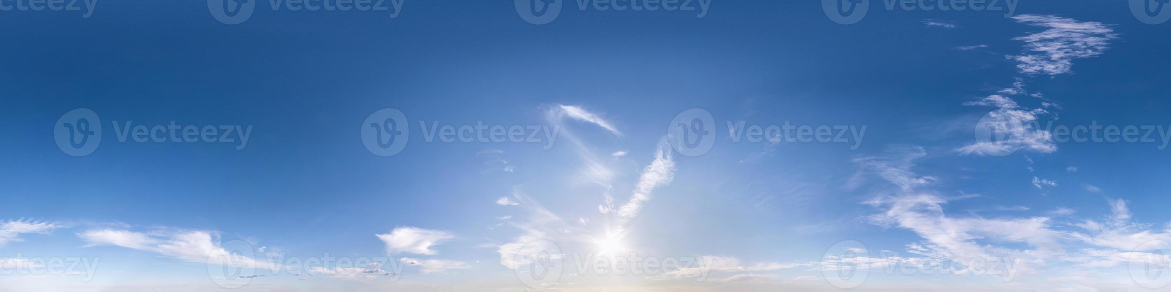 blue sky with beautiful fluffy cumulus clouds. Seamless hdri panorama 360 degrees angle view without ground for use in 3d graphics or game development as sky dome or edit drone shot photo