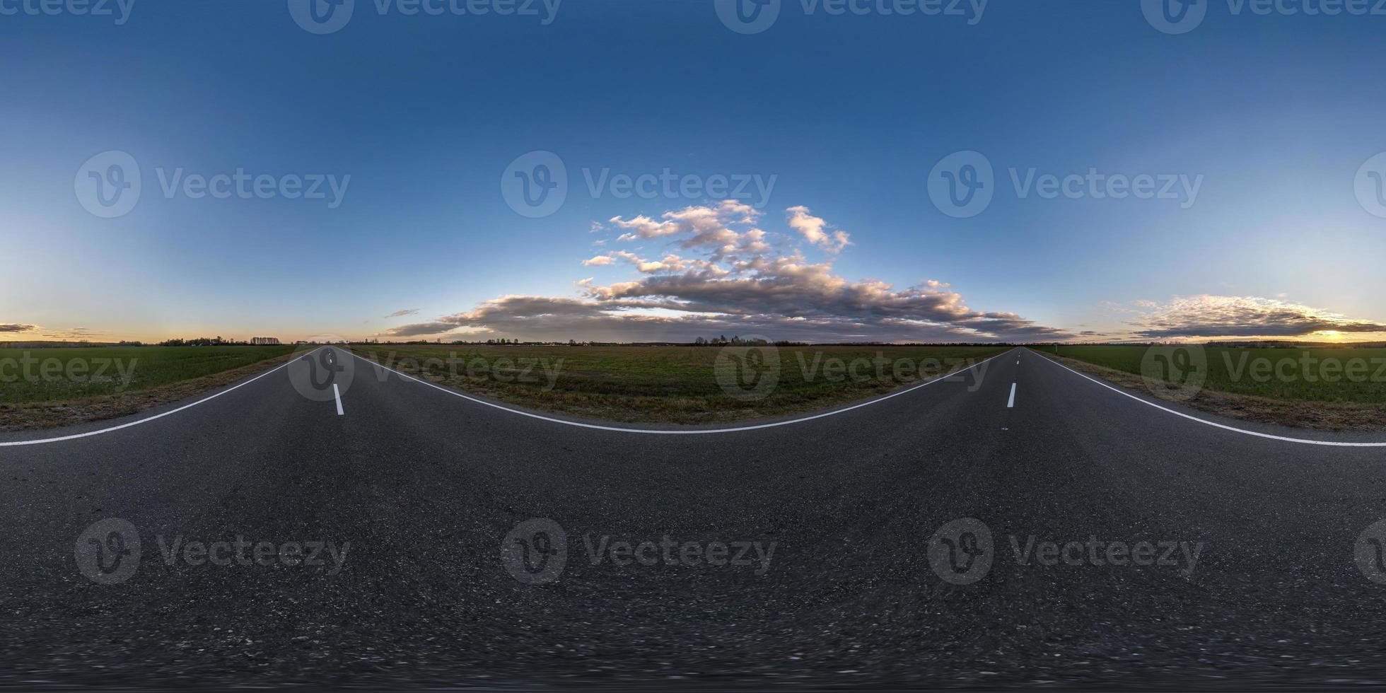 Full spherical hdri seamless panorama 360 degrees angle view on no traffic asphalt road among fields in sunny evening before sunset in equirectangular projection, VR AR content photo