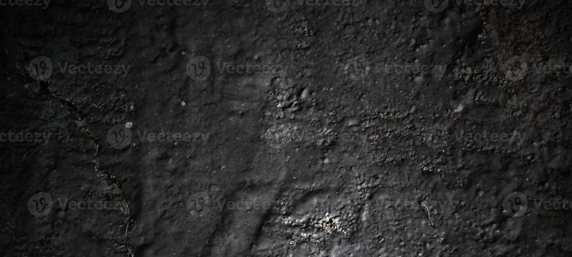 Dark black stone background. scary black concrete texture. Stone wall background. photo