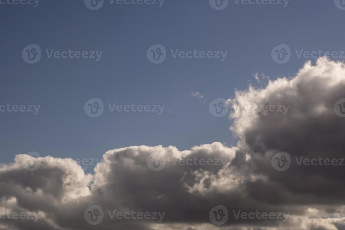 dark Blue sky background with tiny stratus cirrus striped clouds. Clearing evening and Good windy weather photo