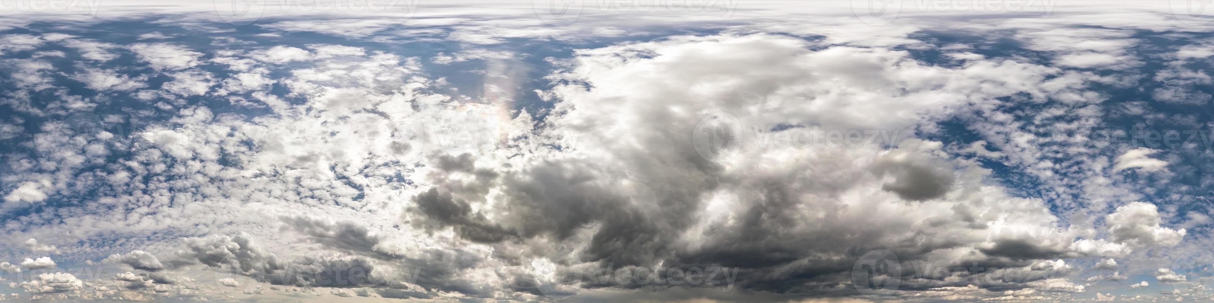 blue sky with beautiful dark clouds before storm. Seamless hdri panorama 360 degrees angle view with zenith for use in 3d graphics or game development as sky dome or edit drone shot photo