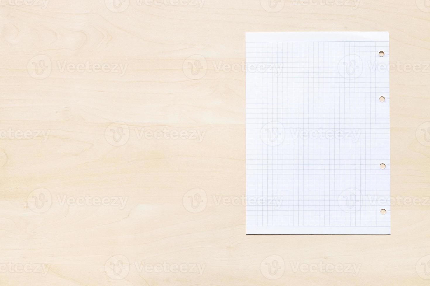 squared paper on light brown board with copyspace photo
