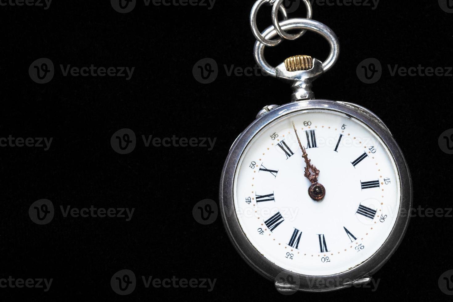 vintage pocket watch on black velvet background photo