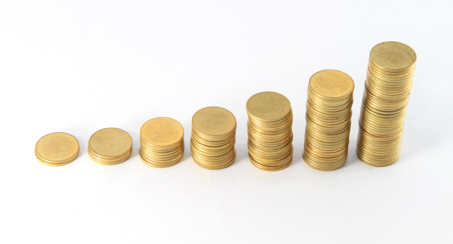 Gold coins. On a white background. photo