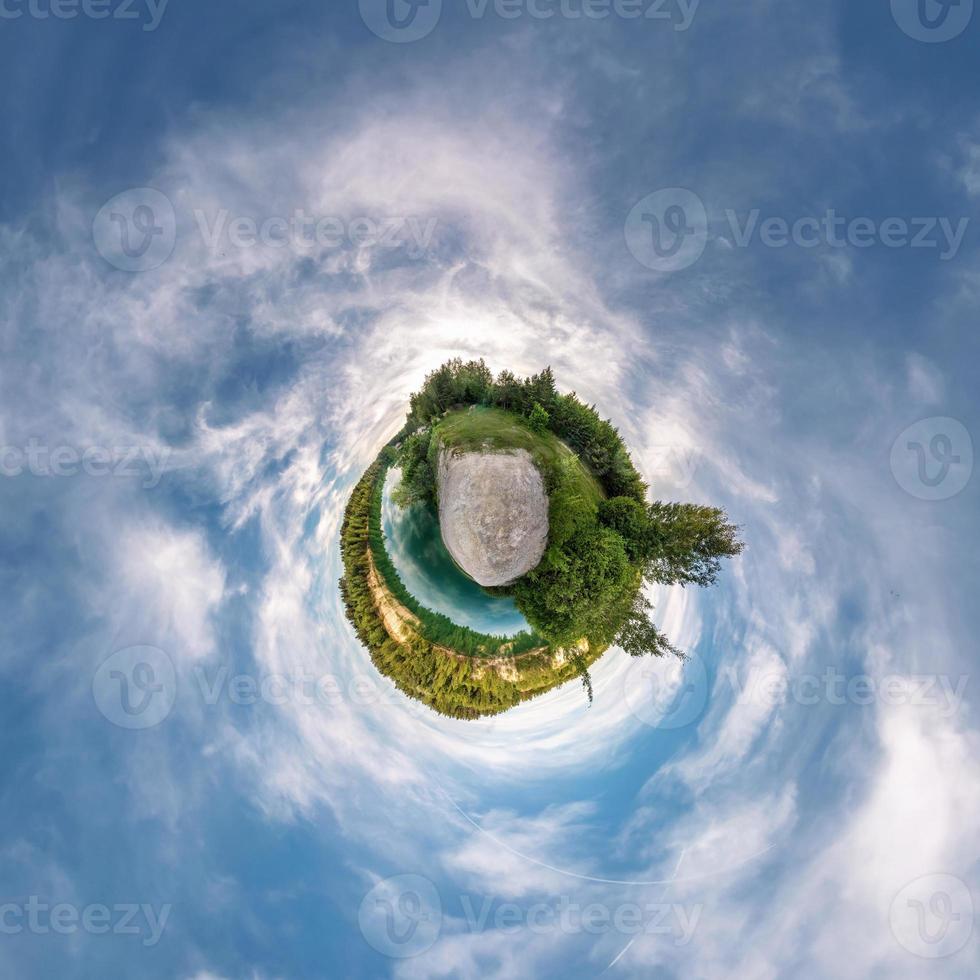 Little planet transformation of spherical panorama 360 degrees. Spherical abstract aerial view in field with awesome beautiful clouds. Curvature of space. photo