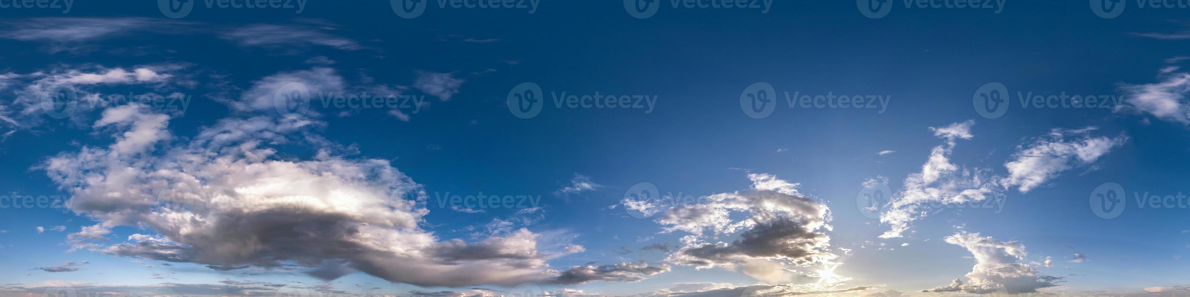 blue sky with beautiful fluffy cumulus clouds. Seamless hdri panorama 360 degrees angle view without ground for use in 3d graphics or game development as sky dome or edit drone shot photo