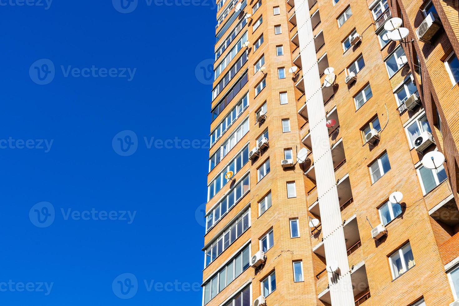 high-rise apartment house and blue sky photo