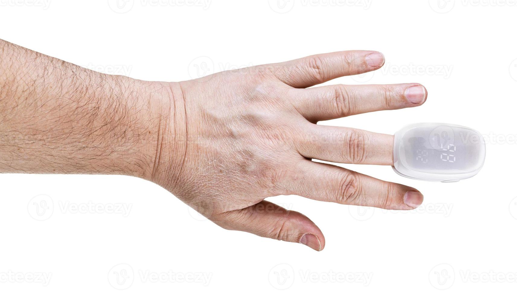 pulse oximeter on male finger tip isolated photo