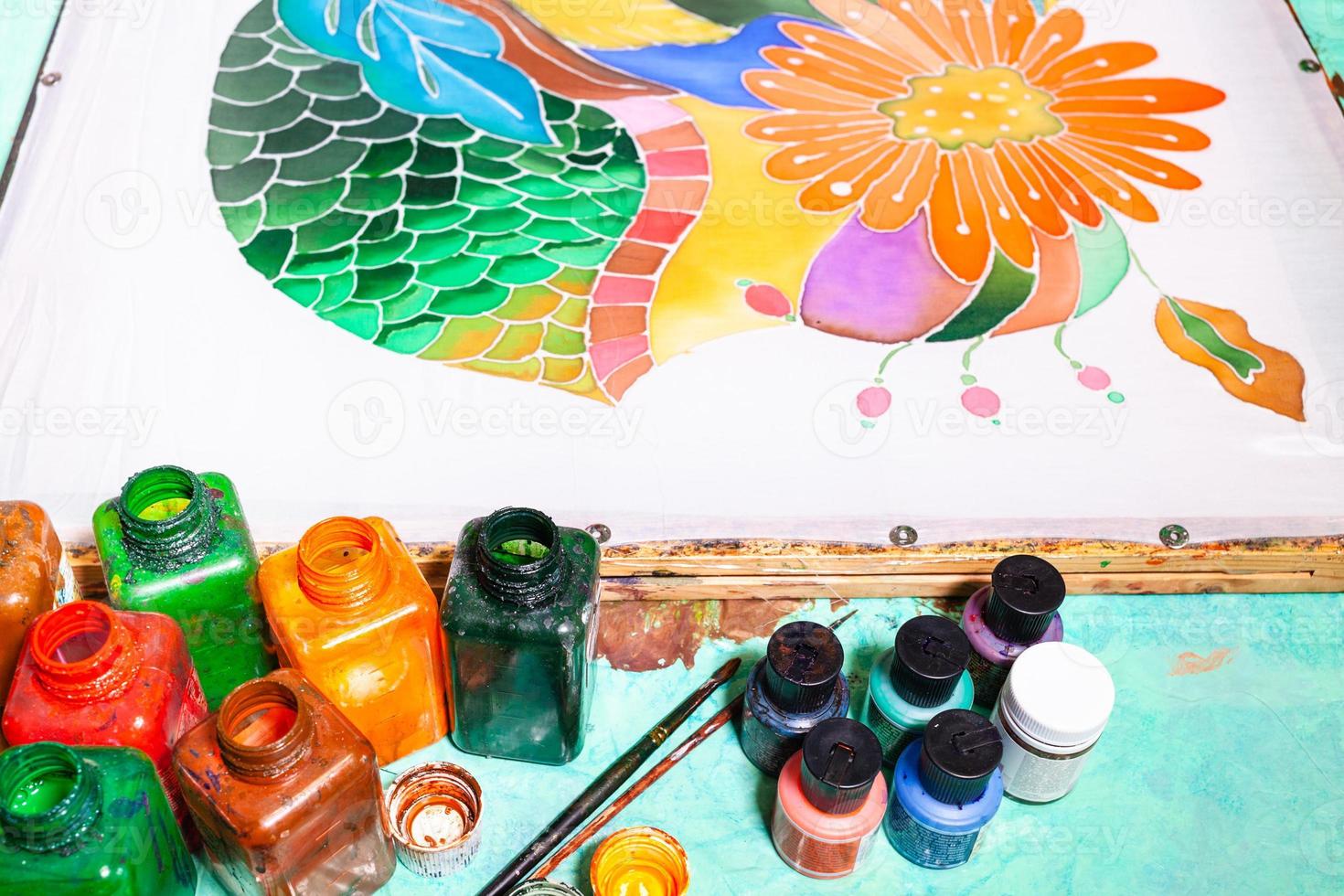 paints and silk canvas with floral batik ornament photo