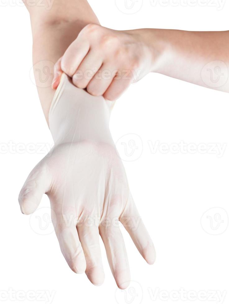 front view of hand wears latex glove on hand photo